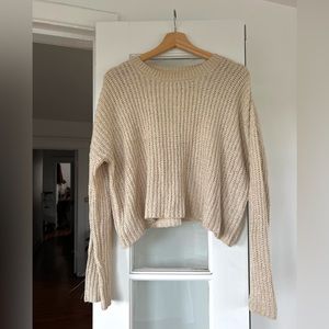 Cropped knit sweater in cream - size small